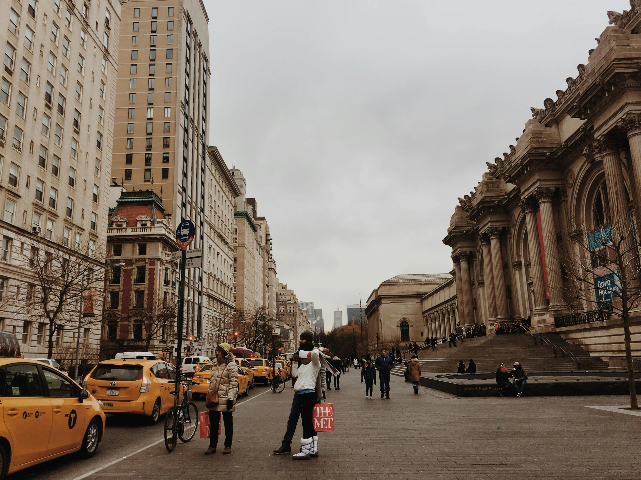 this is people walking down the road in a city