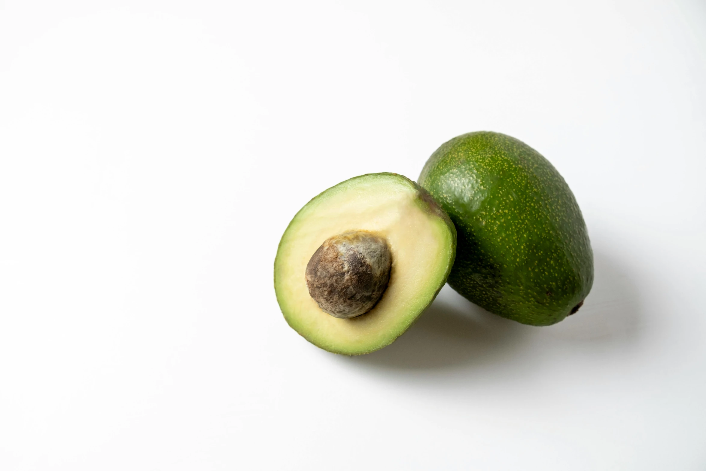 an avocado that is sitting on the floor