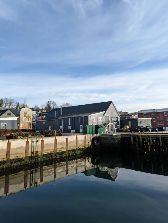 an image of some houses by a river