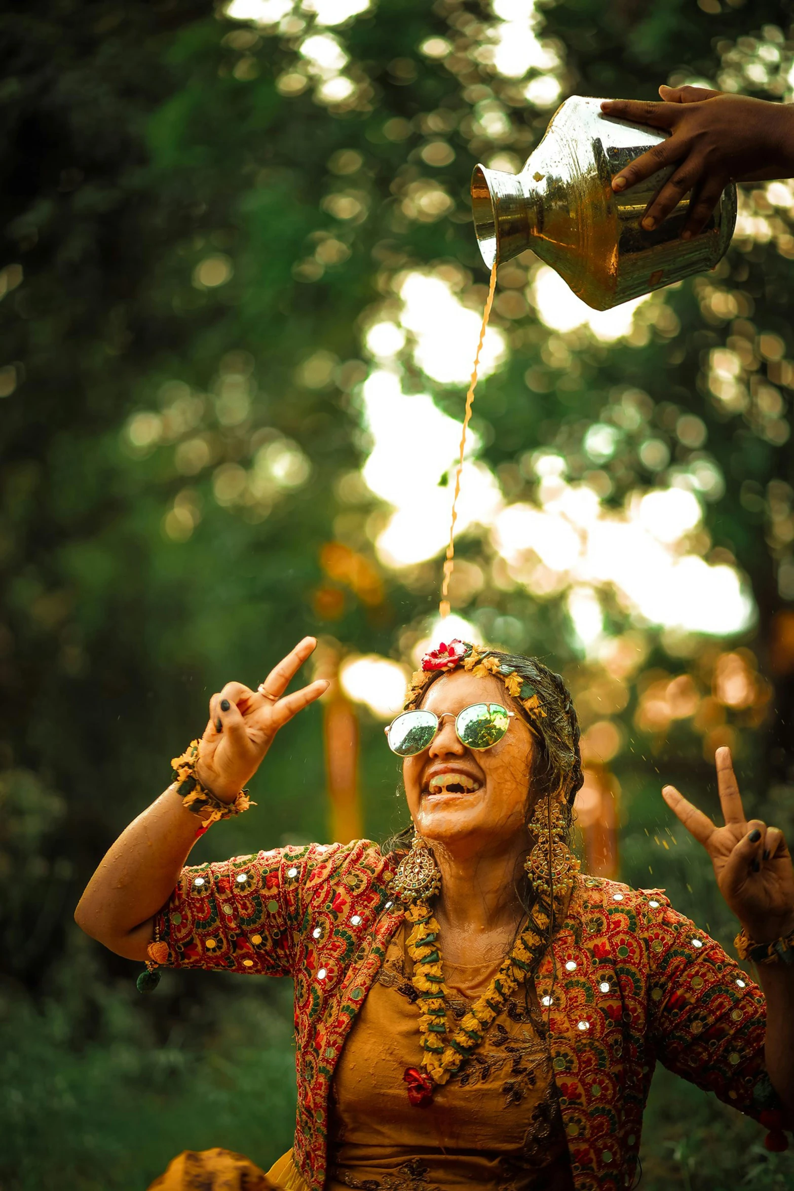 a lady smiles while balancing her hands around her neck