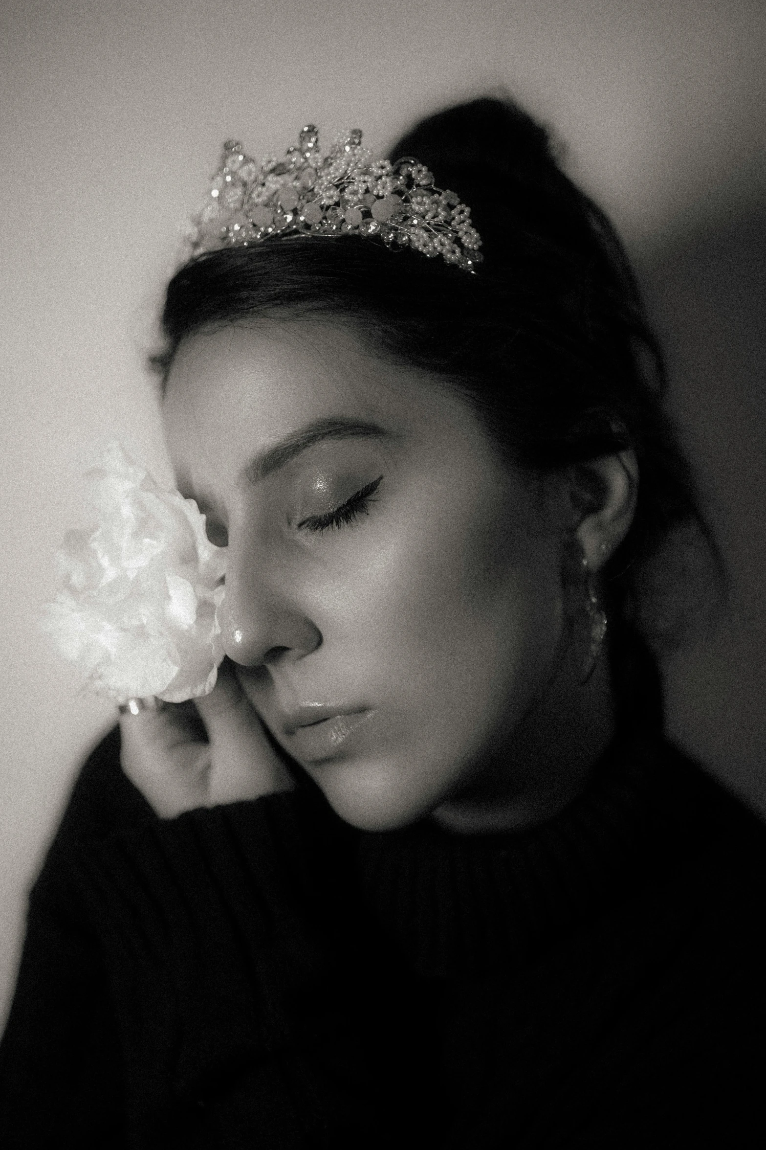 black and white po of a woman wearing a tiara