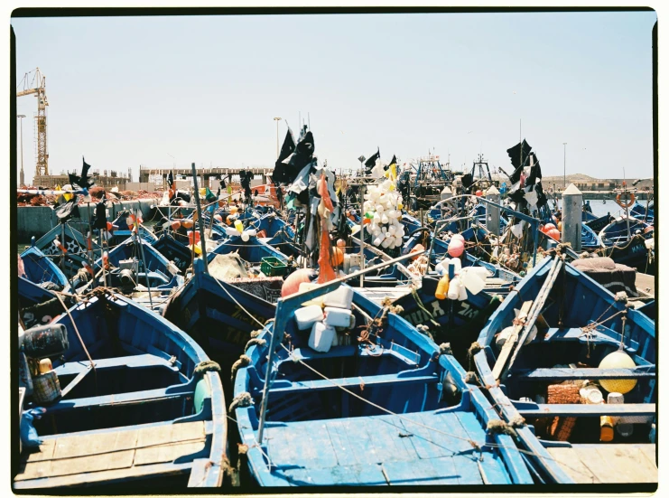 a bunch of old fishing boats in the water