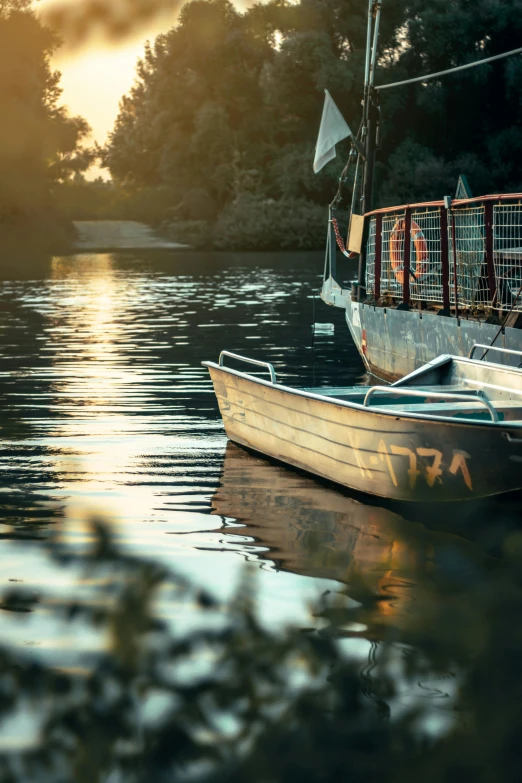 a boat on the water in front of trees