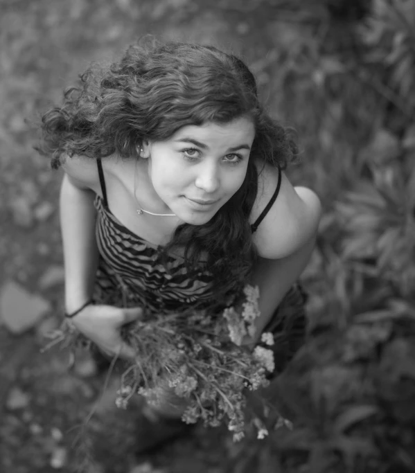 a woman is posing for a black and white po