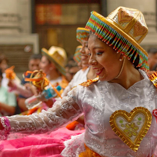 a woman dancing and wearing costume at a festival