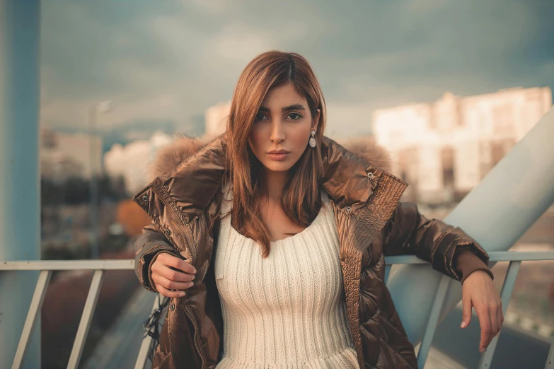 a woman wearing leather and white dress with jacket on