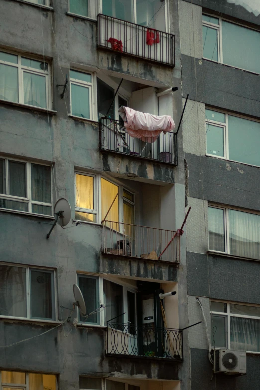 an apartment building with the balconys open