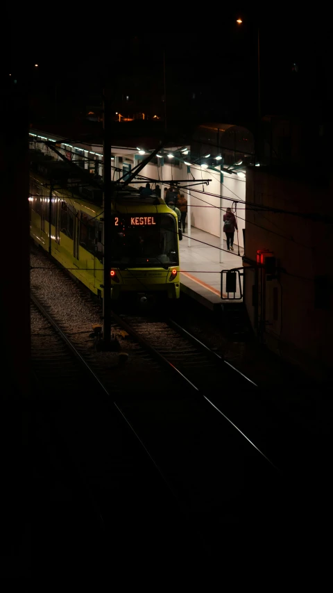 two trains parked side by side on the train tracks