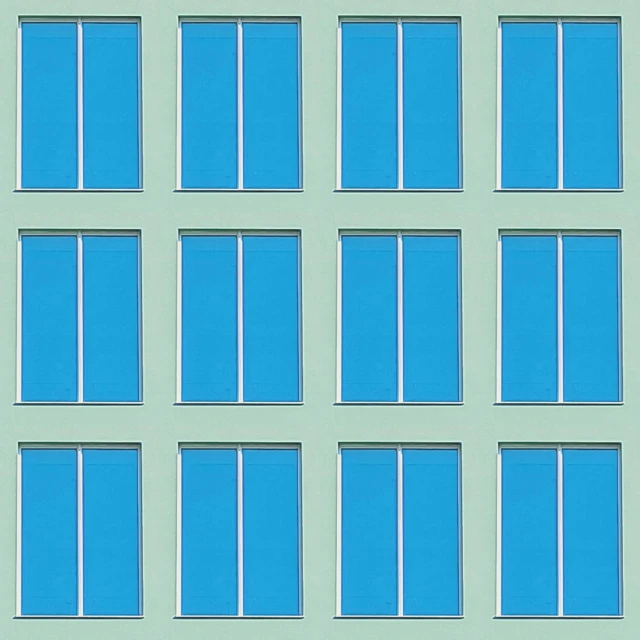 a building has six different blue windows