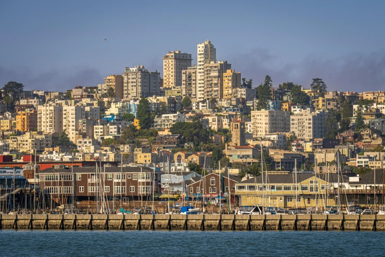 a city on the shore near water with homes and buildings