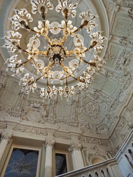 a fancy light fixture hanging from the ceiling in a room