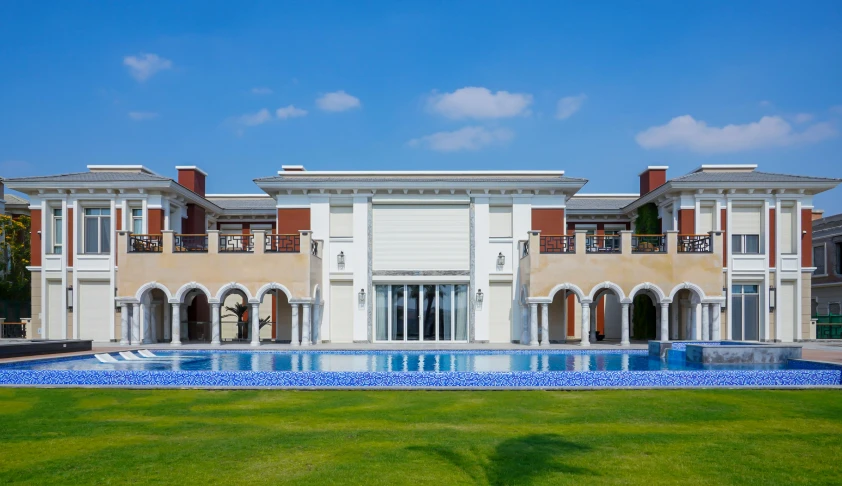 this is a view of a luxury house with a big pool