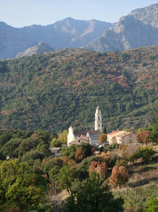 an area with a church and some mountains