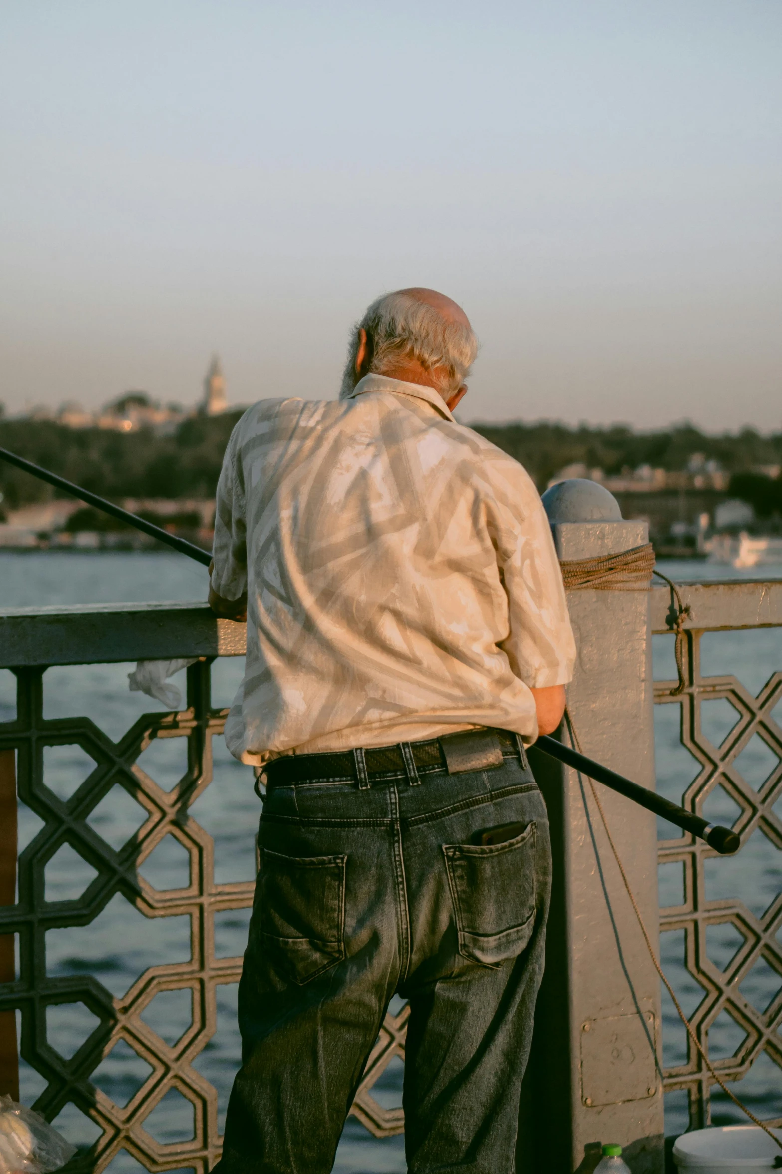 a man on a pier near the water