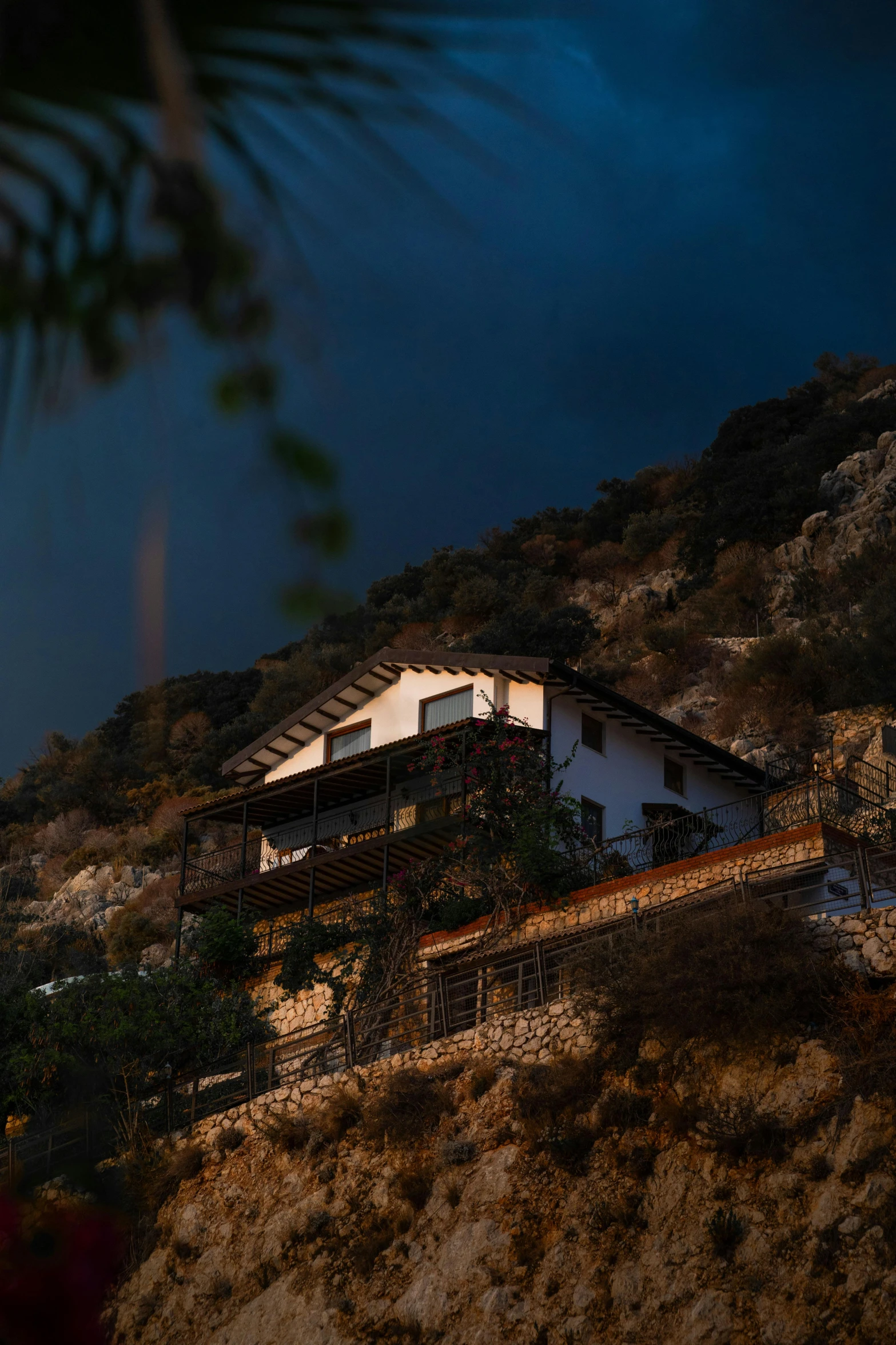 the front of the house is illuminated at night