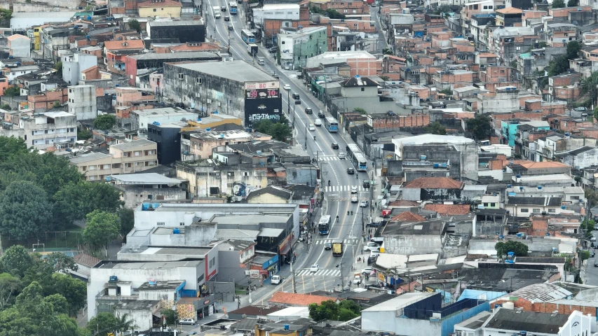 a wide road that runs between many buildings