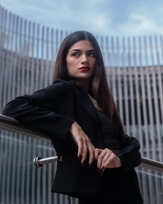 an attractive lady in a black jacket posing for the camera