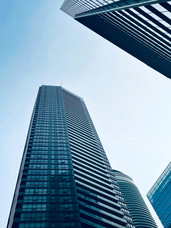 an image of looking up at several buildings