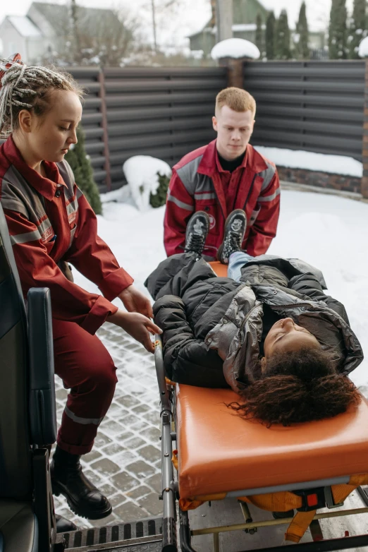 a woman on a gurney being given 