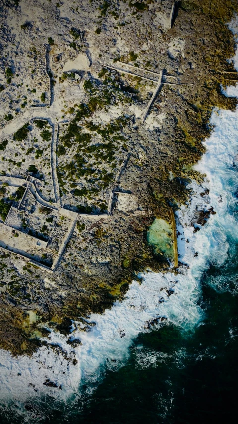 an aerial po of a large structure in the middle of a body of water