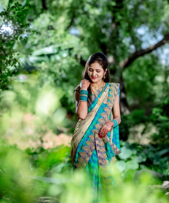 an indian woman in a green dress