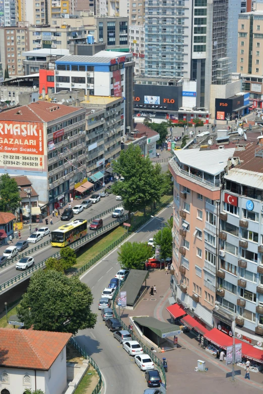 several buses and vehicles moving on a city street