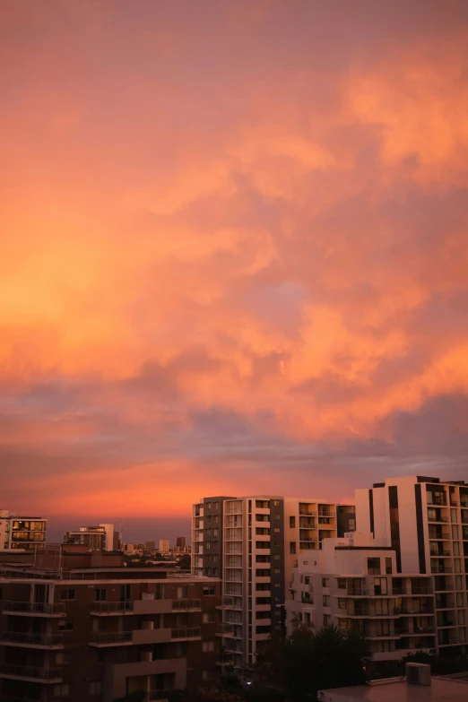 a view of an orange, pink and purple sky