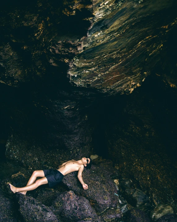 a person is diving into water in a stream