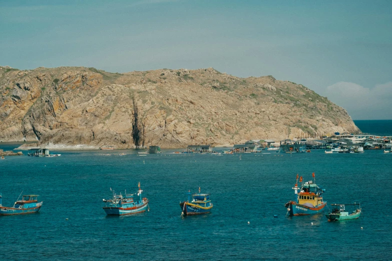 several boats that are sitting in the water