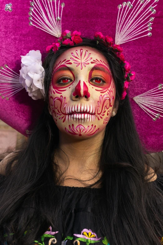 a woman with colorful makeup and headpieces on