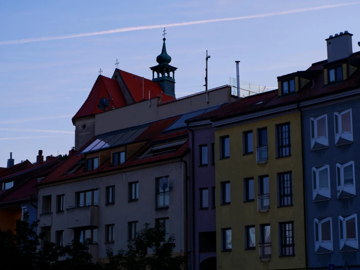 a colorful building with a clock tower in the background