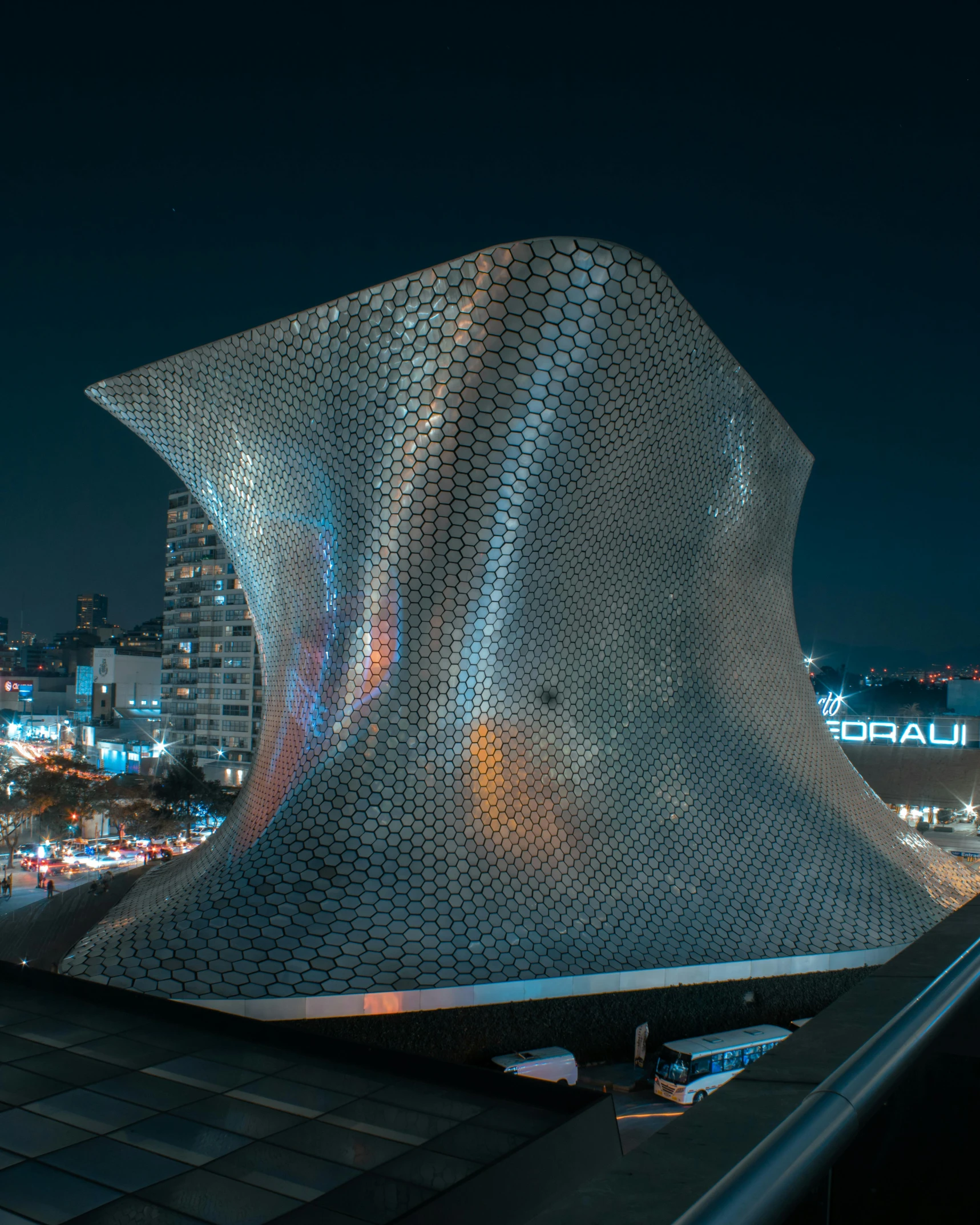 the architecture of a building with lights on at night