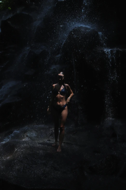 a woman that is standing in some water