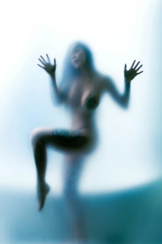 blurry pograph of person dancing in water and body