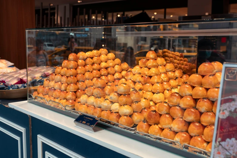 display in the window of a bakery filled with lots of buns