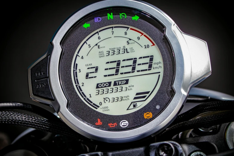 an electronic gauge on the front of a motorcycle