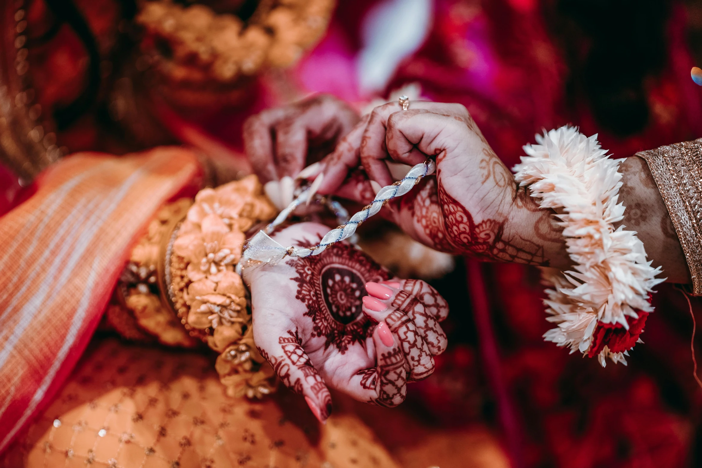 close up view of hands holding a ring and celet