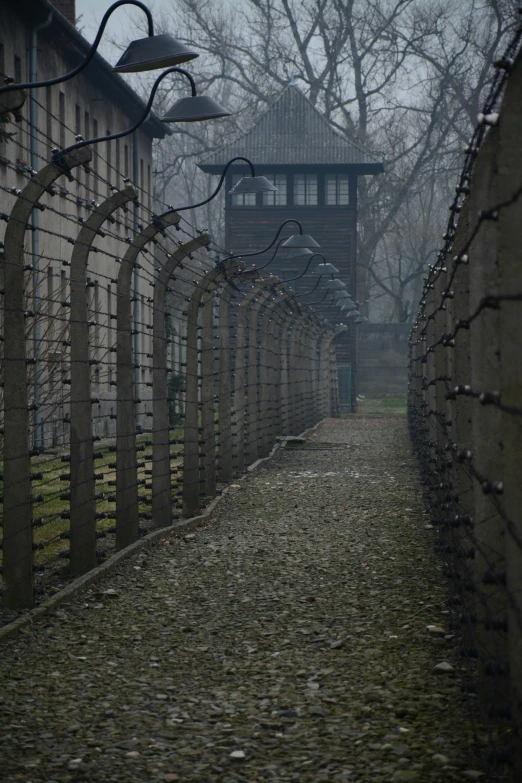 a long walkway lined with an old building