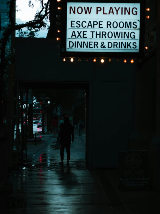 an exit way with light and signs with words on it