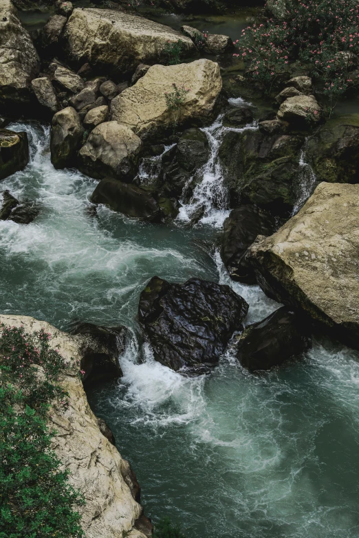 a beautiful s of an old waterfall flowing past it