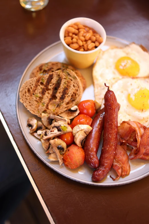 this is a plate of breakfast food on a table