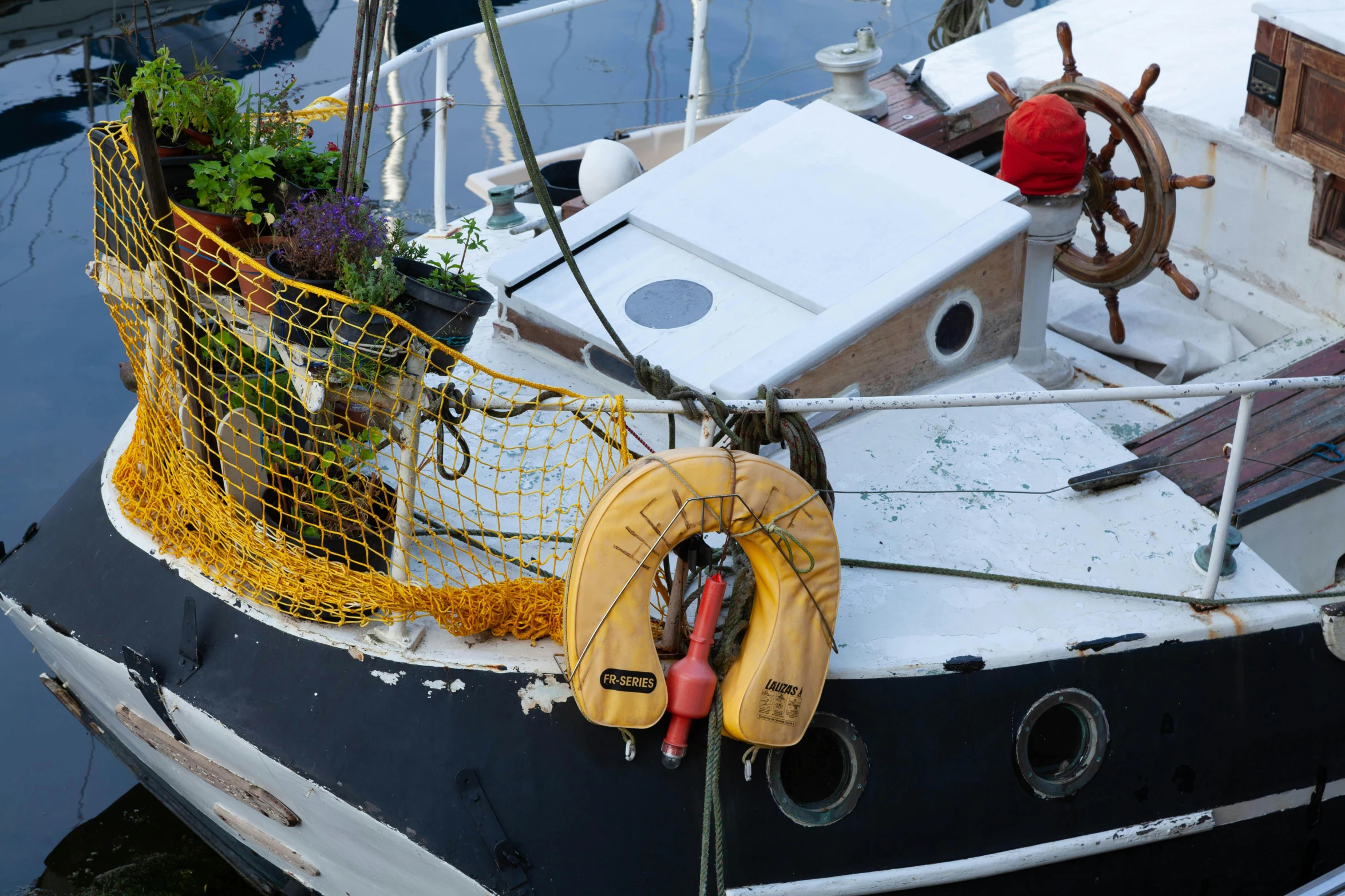 the back end of a boat docked at a pier