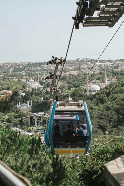 an electric trolley car going down the side of a hill