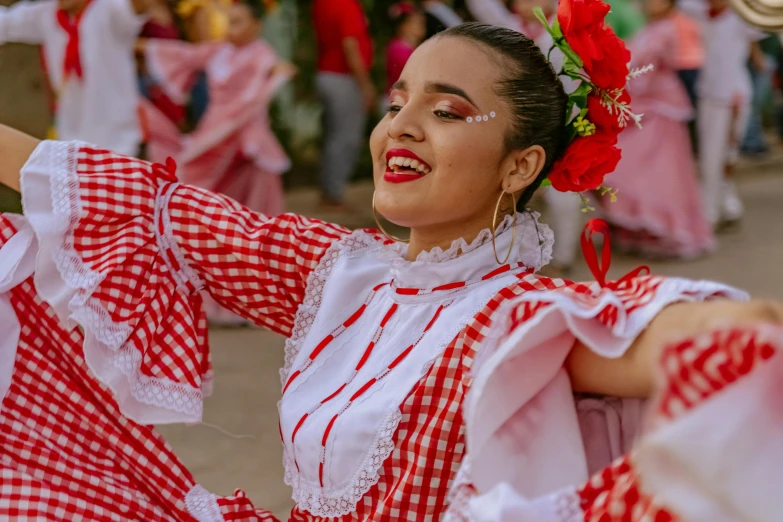 a woman dancing and smiling at an event