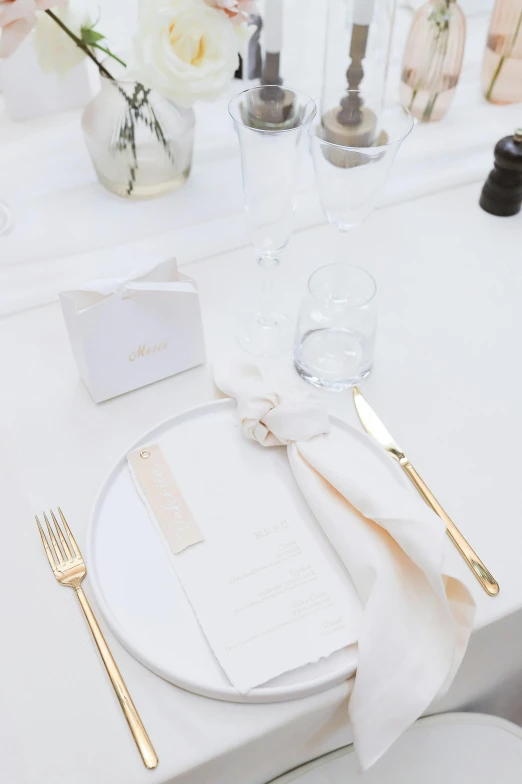 white plate and place setting at a wedding