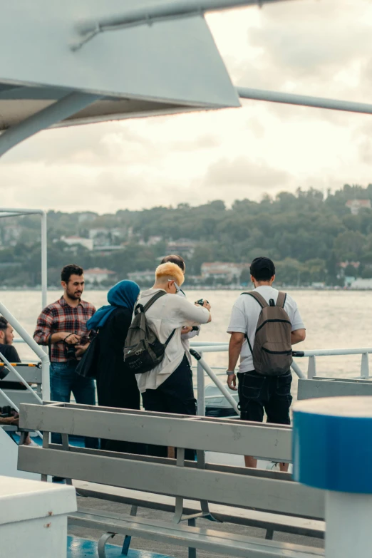 people are lined up at the front of a boat