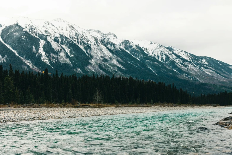 a mountain landscape of rocks near a river