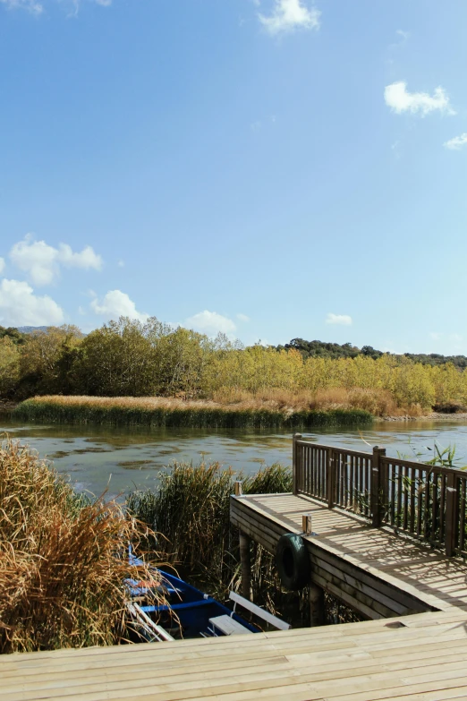 a wooden deck leads to a beautiful water view