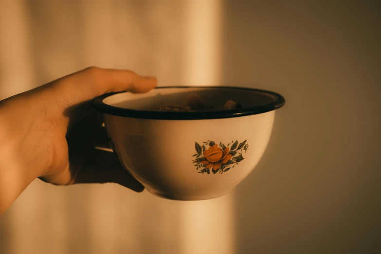 a person is holding their hand with their bowl in front of the camera