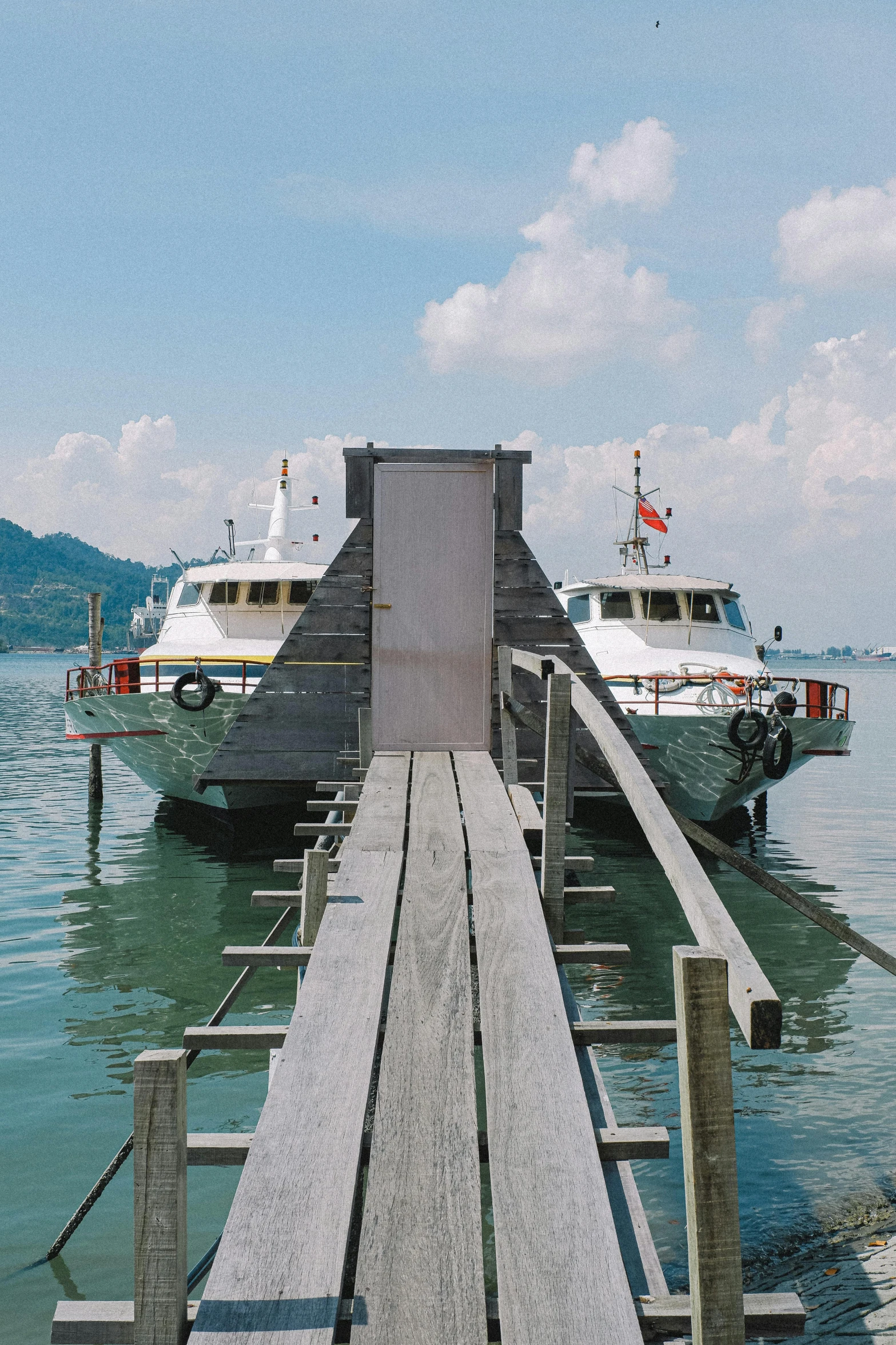 there are two boats parked on a dock